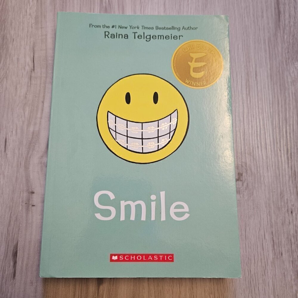 Smile: A Graphic Novel Paperback Book by Raina Telgemeier